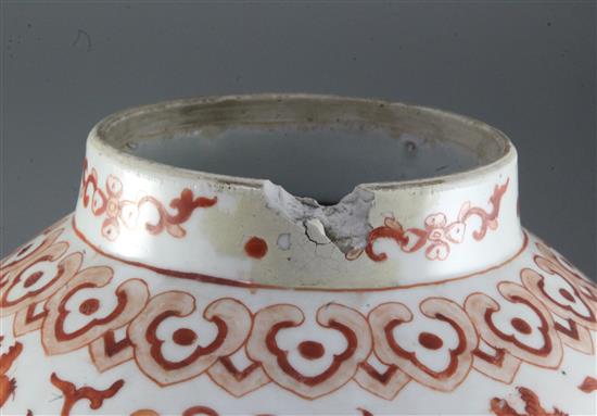 A pair of large Chinese iron red and gilt decorated baluster jars and cover, 19th century, height 43cm, chips to finials on covers